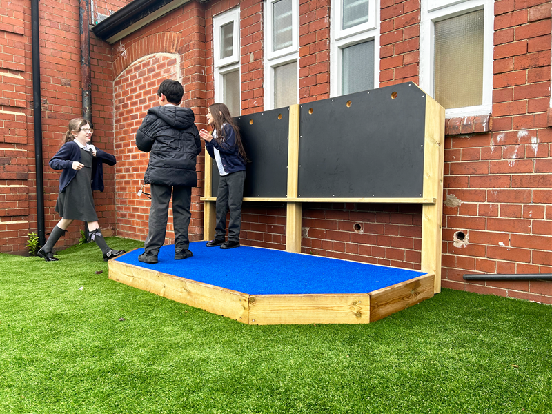 Performance Stage with Chalkboard and Den Making